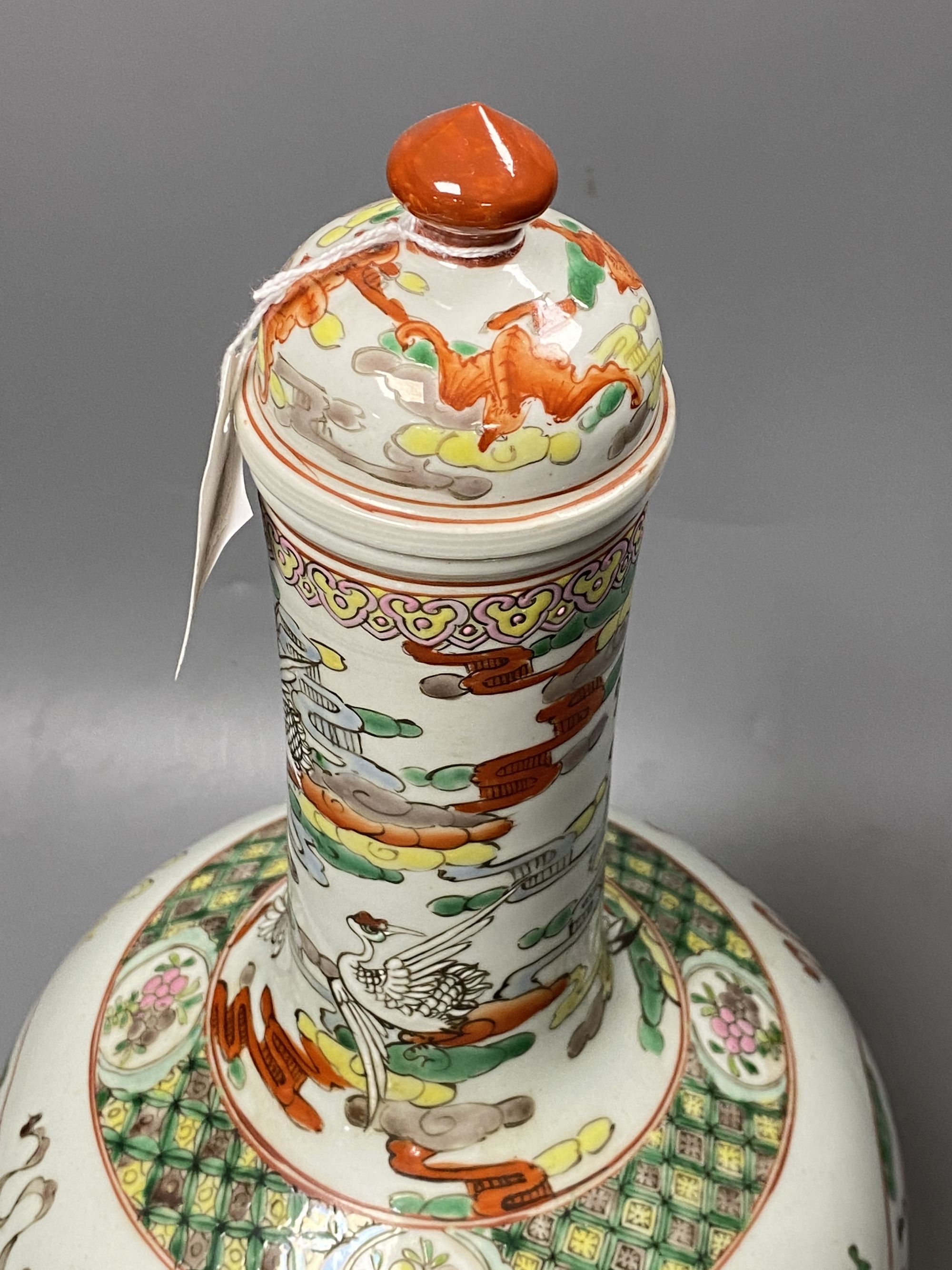 A Chinese famille rose dragon and phoenix bottle vase and cover, 42cm